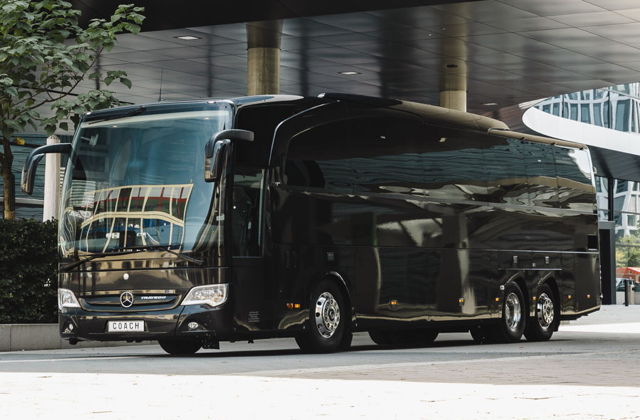 Flotte A huge black luxury Mercedes bus.