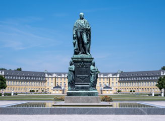 chauffeur service karlsruhe germany Statue in front of the famous Karlsruhe palace.